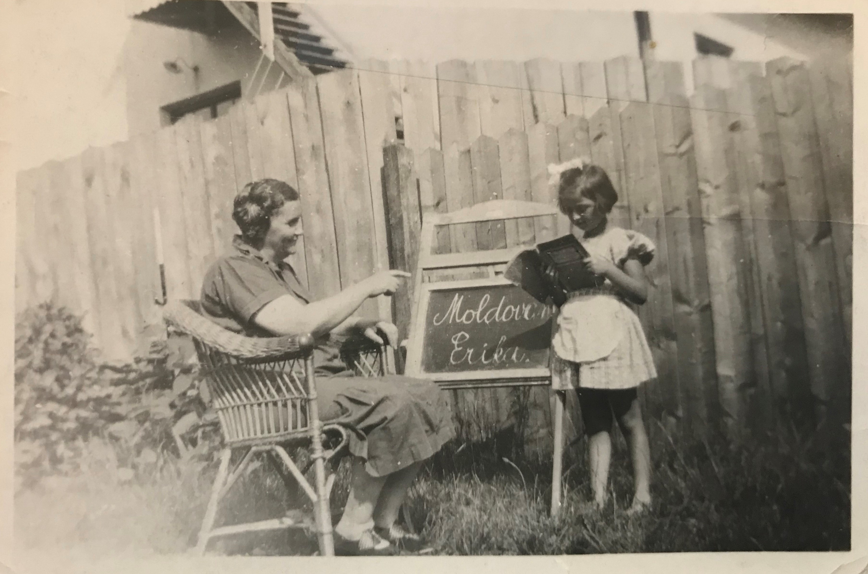 Rosa Moldovan, my great grandmother, teaches my aunt, Erika Goldberger, at home on a chalk board. Jewish students were barred from school during the Nazi regime.